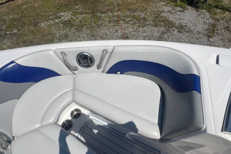 Slide: The Image of 2002 Moomba Mobius LSV boat interior with white and blue seating. - 13