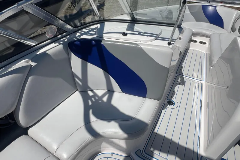 Slide: The Image of 2002 Moomba Mobius LSV boat interior with white and blue seating. - 15