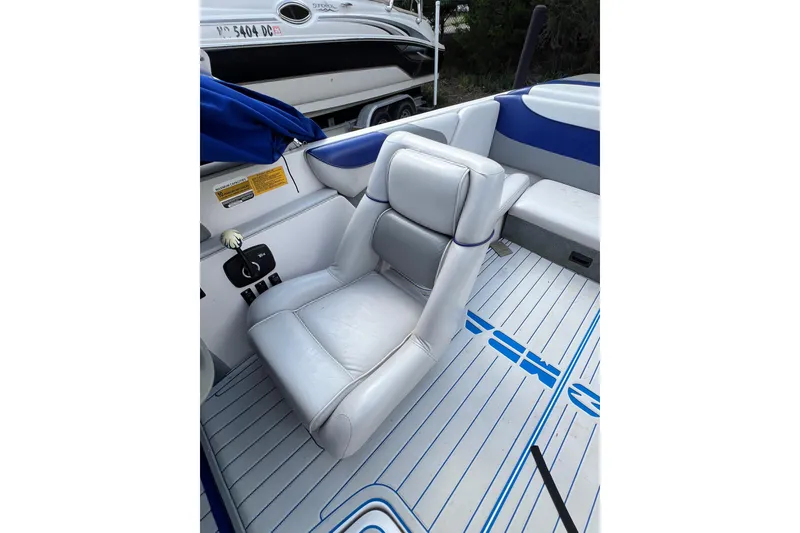 Slide: The Image of 2002 Moomba Mobius LSV boat interior with white and blue seating. - 4