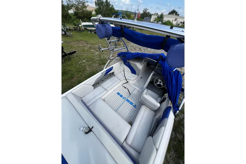 Slide: The Image of 2002 Moomba Mobius LSV boat interior with blue and white seating and canopy. - 7