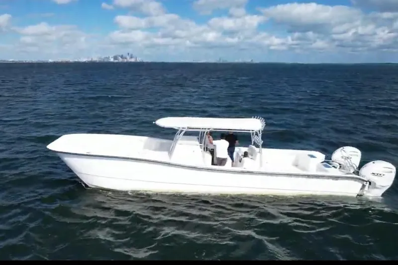 Slide: The Image of 2025 AmeraCat 39 boat cruising on open water under a partly cloudy sky. - 12