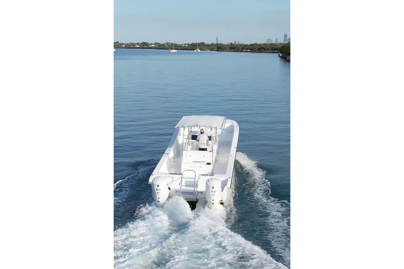 Slide: The Image of 2025 AmeraCat 39 boat cruising on a calm blue waterway. - 17