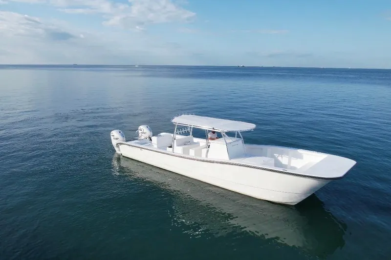 Slide: The Image of 2025 AmeraCat 39 boat cruising on calm ocean waters under a clear blue sky. - 9