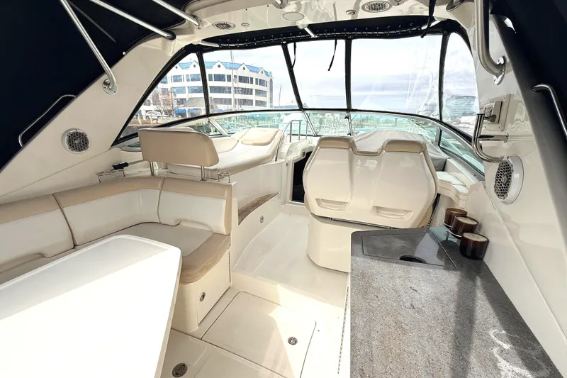 Slide: The Image of Interior of a 2013 Sea Ray Sundancer 350 yacht with seating and helm. - 3