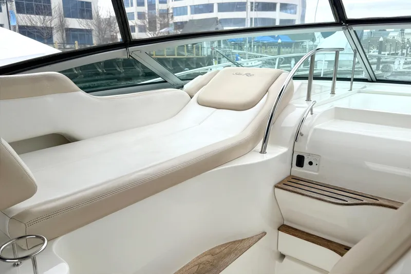 Slide: The Image of Interior view of 2013 Sea Ray Sundancer 350 yacht with beige seating and wooden steps. - 4