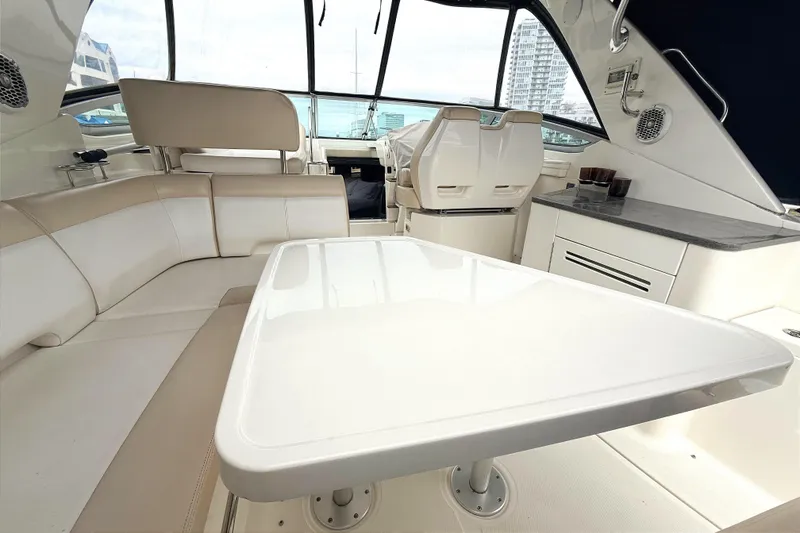Slide: The Image of Interior of 2013 Sea Ray Sundancer 350 yacht with seating and table. - 7