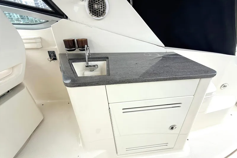 Slide: The Image of 2013 Sea Ray Sundancer 350 boat interior with sink and countertop. - 8