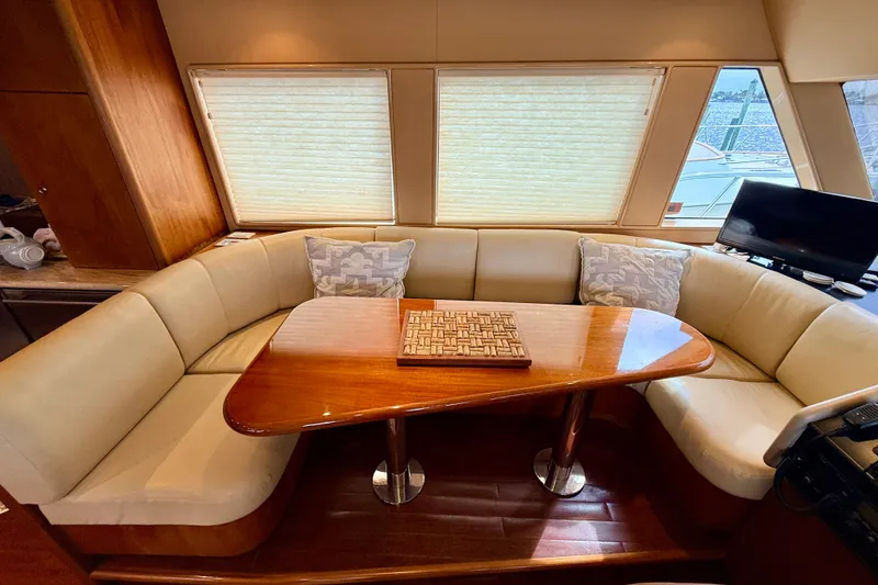 Slide: The Image of Luxurious interior of 2002 Cheoy Lee 72 Raised Pilot House Motor Yacht with elegant seating. - 18