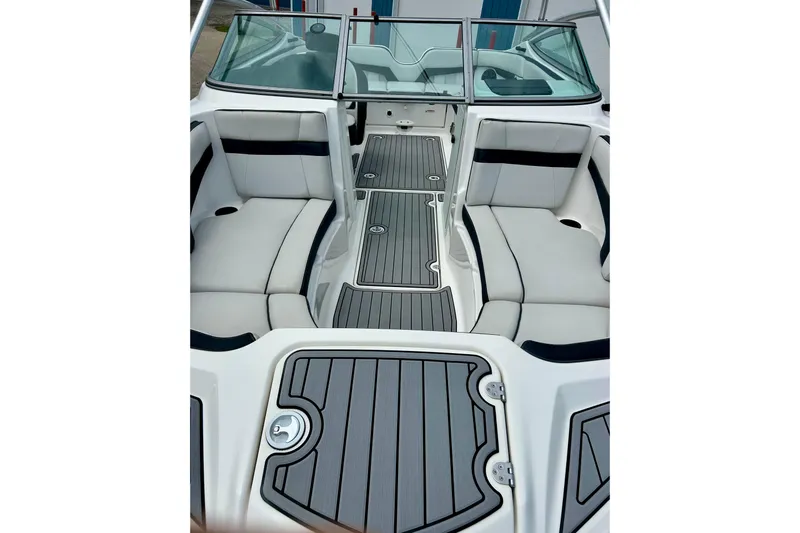 Slide: The Image of 2015 Yamaha Boats AR210 interior with sleek seating and modern design. - 13