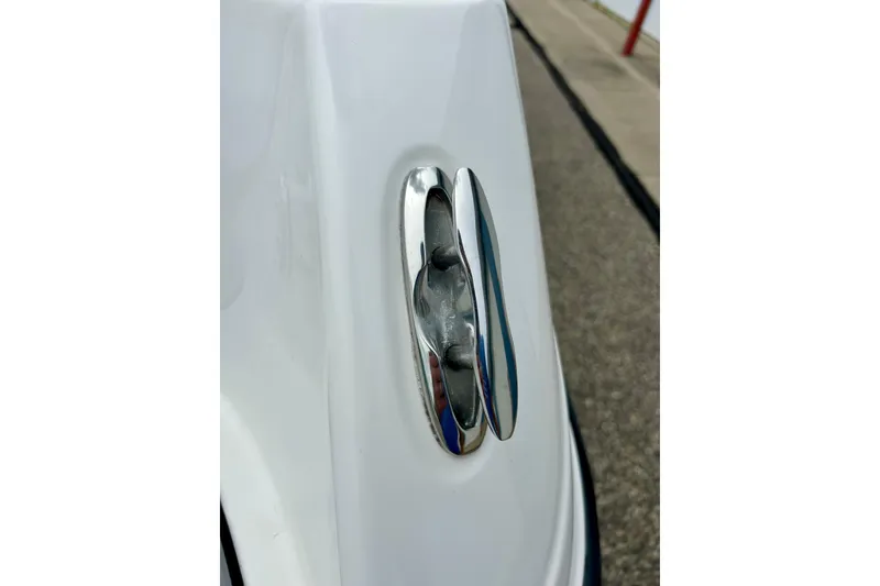 Slide: The Image of Close-up of a 2015 Yamaha AR210 boat cleat on a white surface. - 24