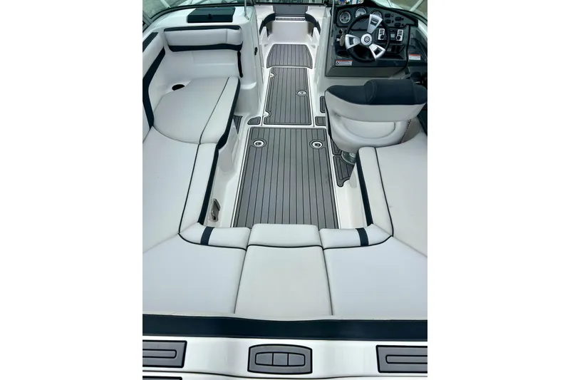 Slide: The Image of 2015 Yamaha Boats AR210 interior with sleek seating and modern dashboard design. - 25
