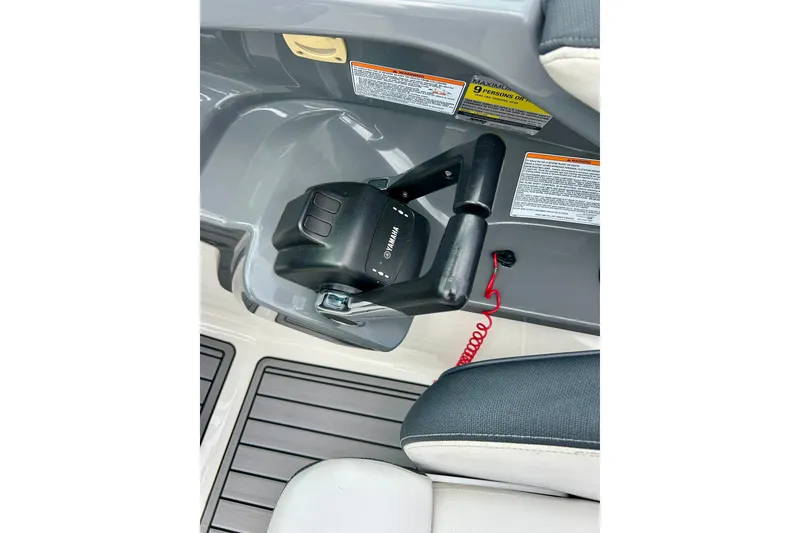 Slide: The Image of Yamaha AR210 2015 boat throttle control with safety lanyard and warning labels. - 27