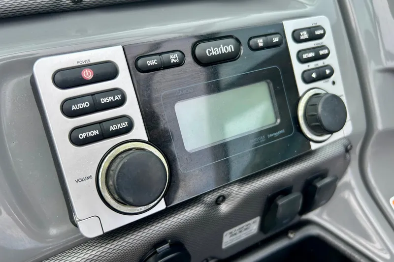 Slide: The Image of Close-up of Clarion audio system in 2015 Yamaha AR210 boat dashboard. - 30