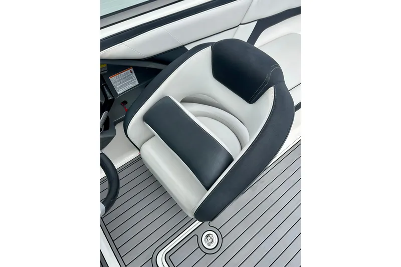 Slide: The Image of 2015 Yamaha Boats AR210 seat with sleek black and white design on deck. - 34