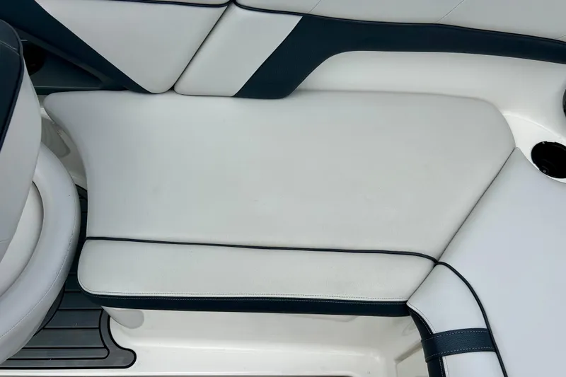 Slide: The Image of 2015 Yamaha AR210 boat interior seating with white and dark accents. - 39