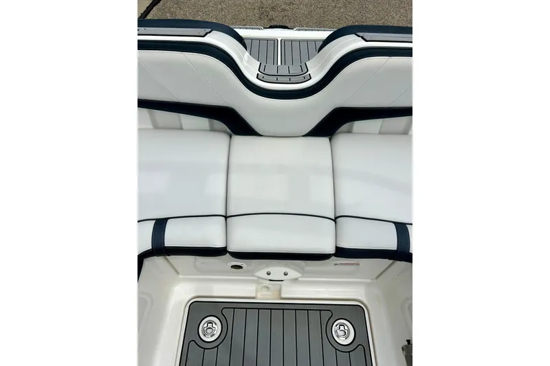 Slide: The Image of 2015 Yamaha Boats AR210 interior seating and deck detail, featuring sleek white and black design. - 42