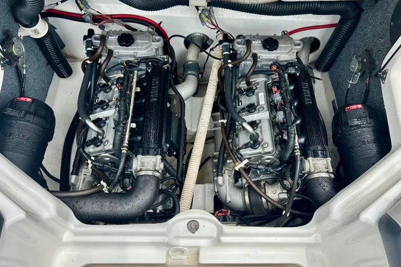 Slide: The Image of 2015 Yamaha Boats AR210 engine compartment with dual engines and wiring. - 43