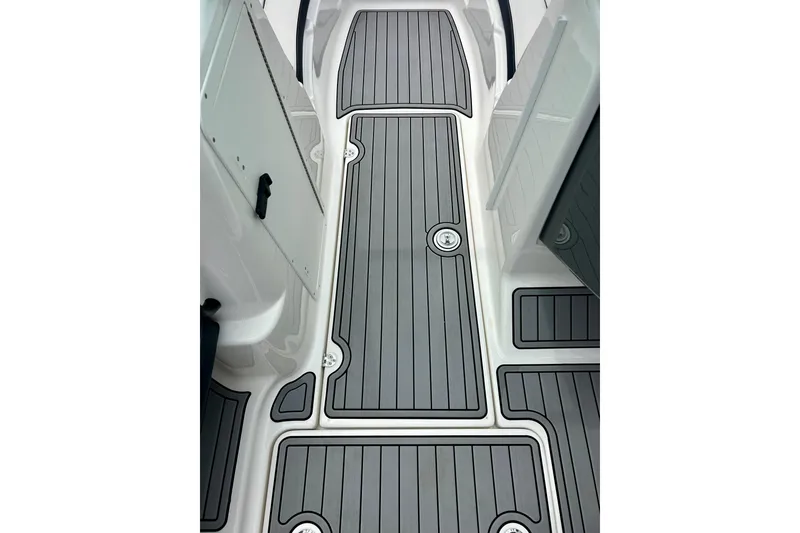 Slide: The Image of 2015 Yamaha AR210 boat deck with sleek, modern gray flooring design. - 46