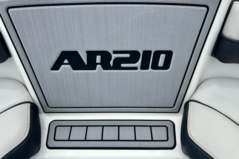 Slide: The Image of 2015 Yamaha Boats AR210 interior detail with sleek design and branding. - 48