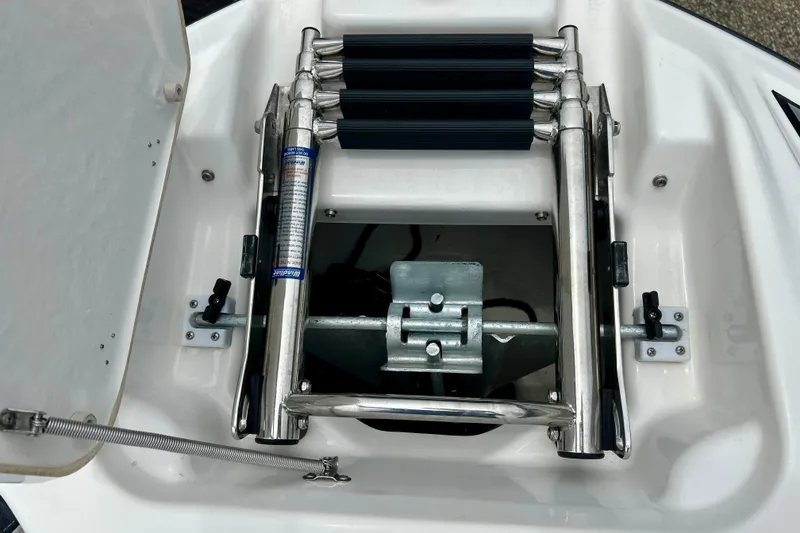 Slide: The Image of 2015 Yamaha AR210 boat ladder compartment with stainless steel retractable ladder. - 50