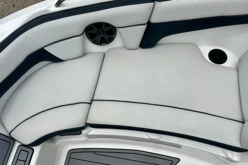 Slide: The Image of 2015 Yamaha Boats AR210 interior seating with speaker and cup holder. - 51