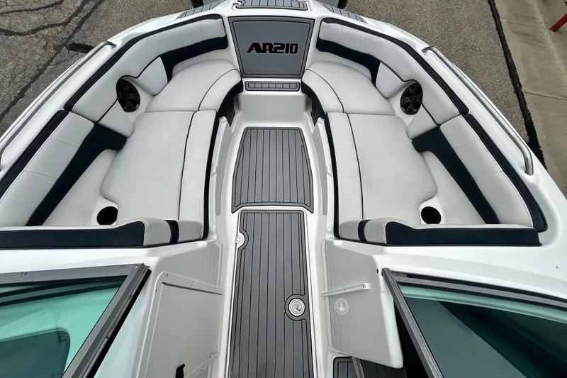 Slide: The Image of 2015 Yamaha Boats AR210 interior with sleek seating and modern design. - 56