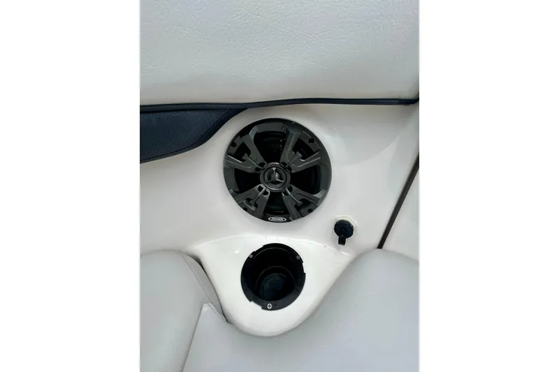 Slide: The Image of Speaker and cup holder on 2015 Yamaha AR210 boat interior. - 57