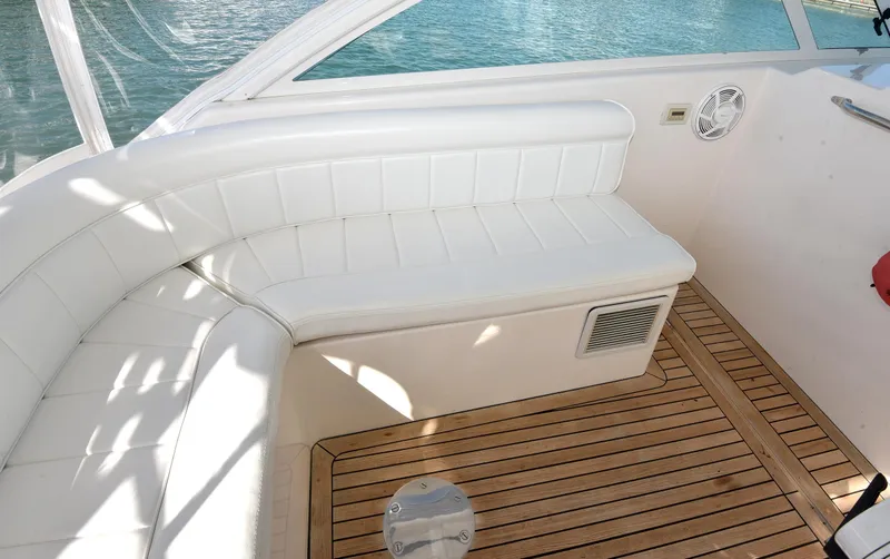 Slide: The Image of Interior of a 2005 Cabo 40 Express yacht with white seating area. - 45