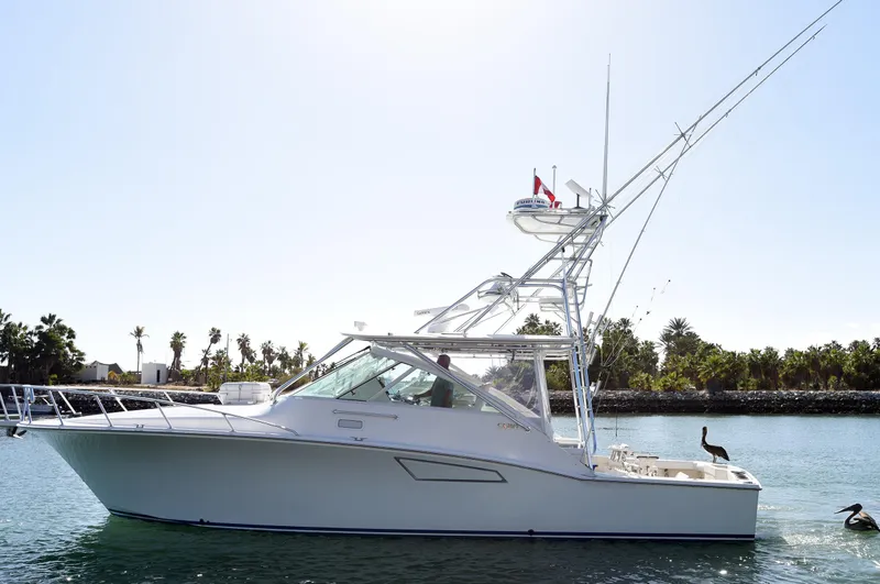 Slide: The Image of Cabo 40 Express 2005 yacht on calm water. - 5