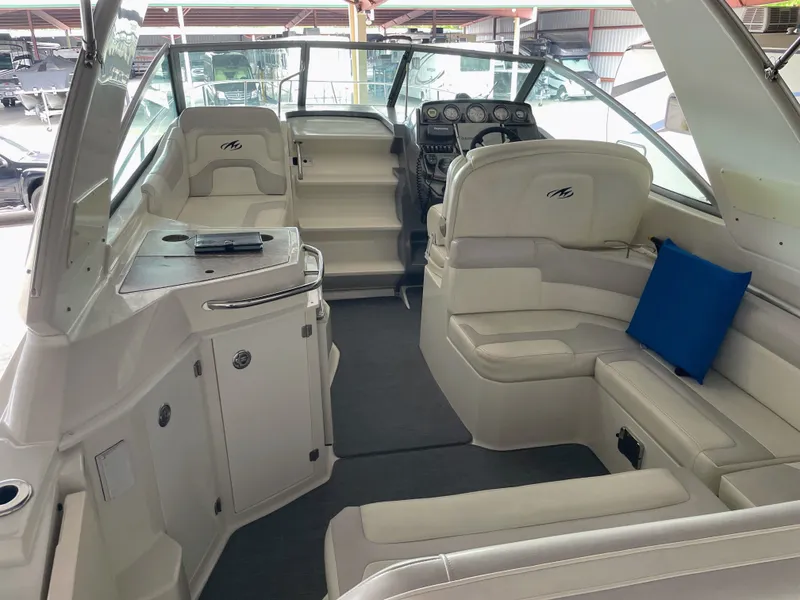 Slide: The Image of Interior of a 2010 Monterey 280 Sport Cruiser with white seating. - 14