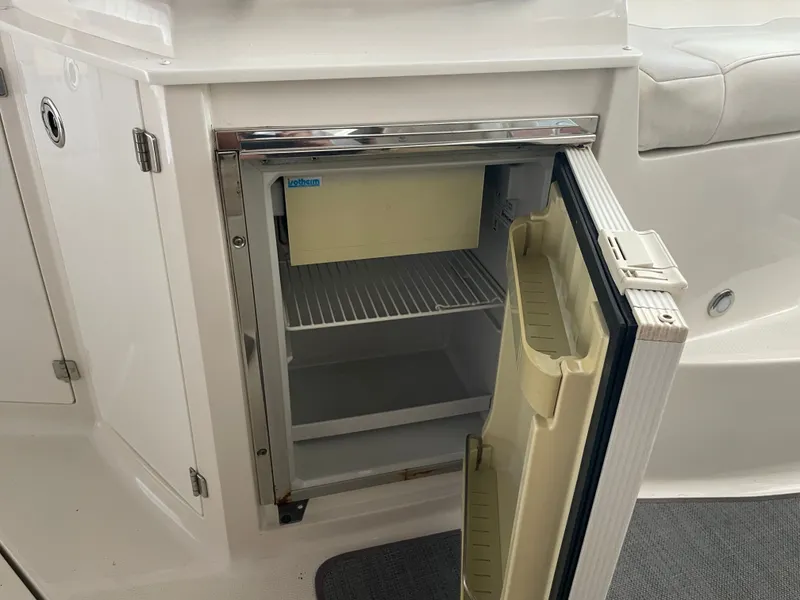 Slide: The Image of Open fridge on a Monterey 280 Sport Cruiser boat. - 25