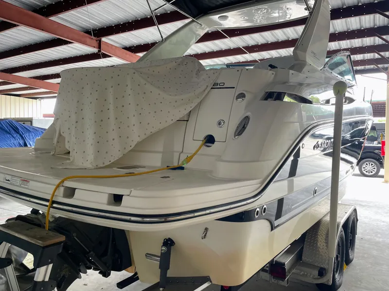Slide: The Image of 2010 Monterey 280 Sport Cruiser on trailer in storage facility. - 2