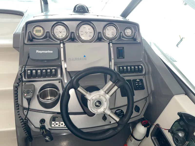 Slide: The Image of Helm console of a 2010 Monterey 280 Sport Cruiser boat. - 27