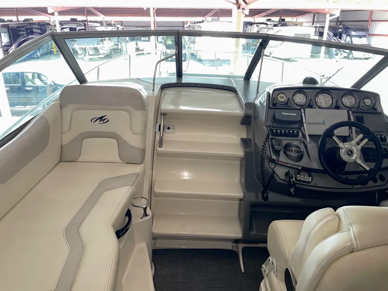 Slide: The Image of Interior of 2010 Monterey 280 Sport Cruiser with helm console. - 23