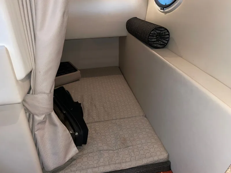 Slide: The Image of Interior of 2010 Monterey 280 Sport Cruiser with bed and window. - 41