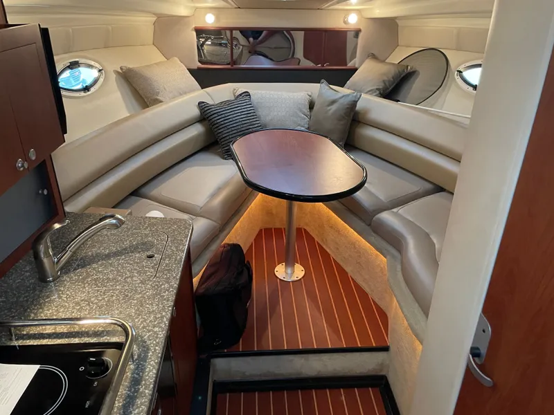 Slide: The Image of Interior of 2010 Monterey 280 Sport Cruiser with kitchenette and seating area. - 31