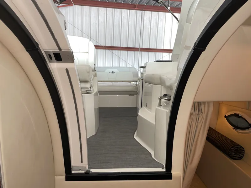 Slide: The Image of Interior of a 2010 Monterey 280 Sport Cruiser with white seating. - 43