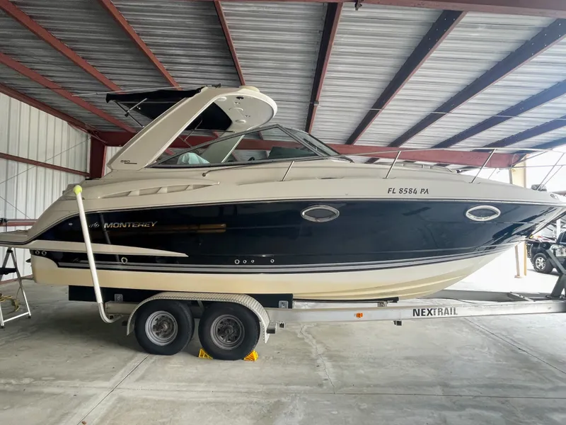 Slide: The Image of 2010 Monterey 280 Sport Cruiser on trailer in storage facility. - 1