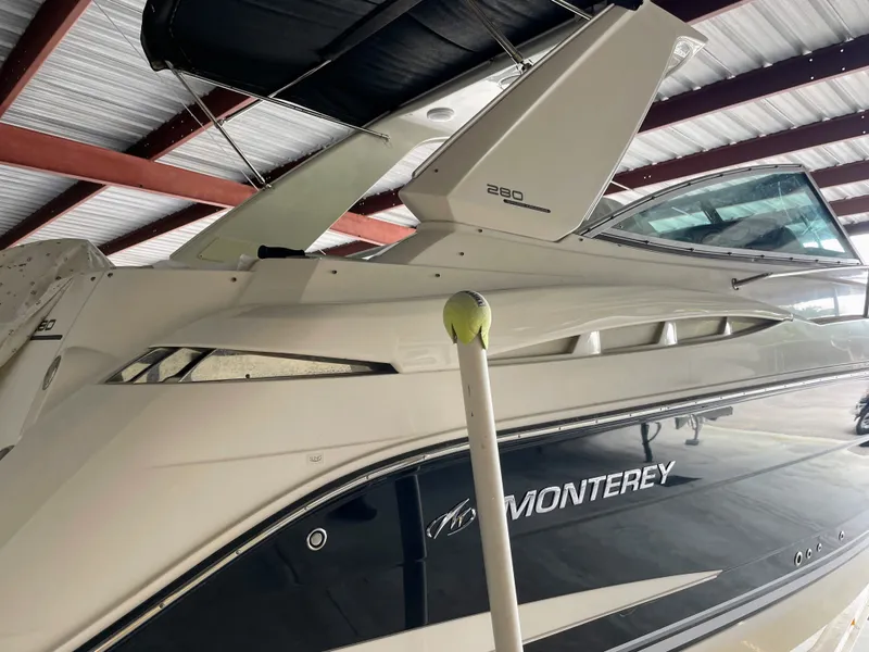 Slide: The Image of Monterey 280 Sport Cruiser 2010 in a covered storage facility. - 7