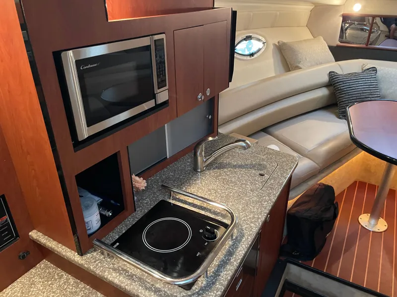 Slide: The Image of Interior of 2010 Monterey 280 Sport Cruiser with kitchen and seating area. - 32
