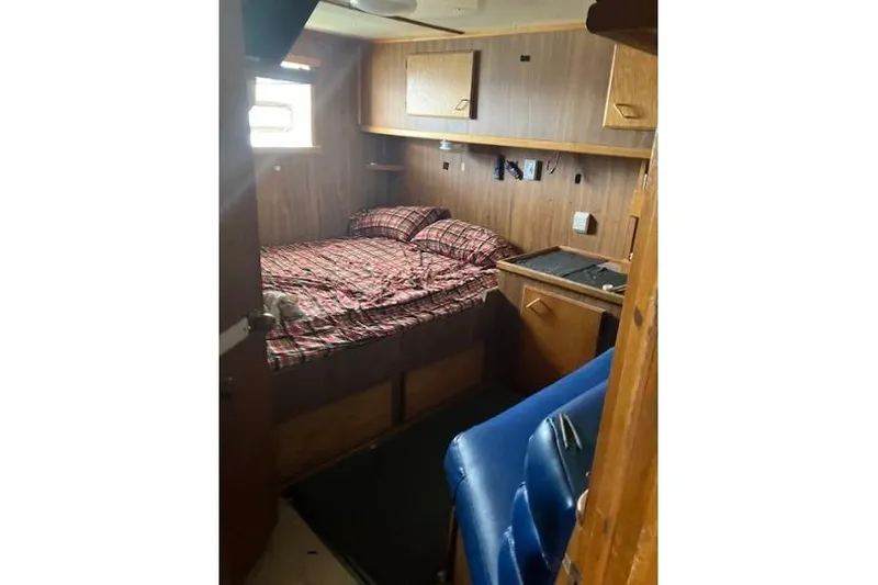 Slide: The Image of Cozy cabin interior of 1995 Custom Steel Albacore Tuna Vessel with plaid bedding. - 2