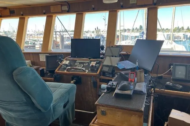 Slide: The Image of Interior of a 1995 Custom Steel Albacore Tuna Vessel's control room with navigation equipment. - 23