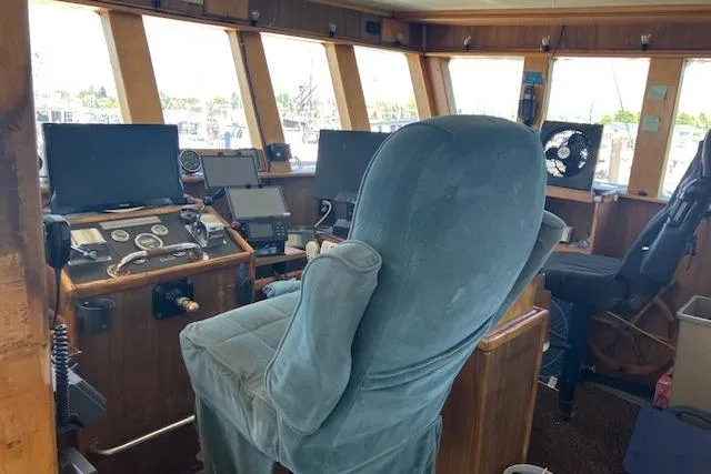 Slide: The Image of Bridge interior of a 1995 Custom Steel Albacore Tuna Vessel with navigation equipment. - 24