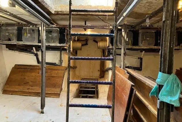 Slide: The Image of Interior of a 1995 custom steel albacore tuna vessel with ladder and equipment. - 4