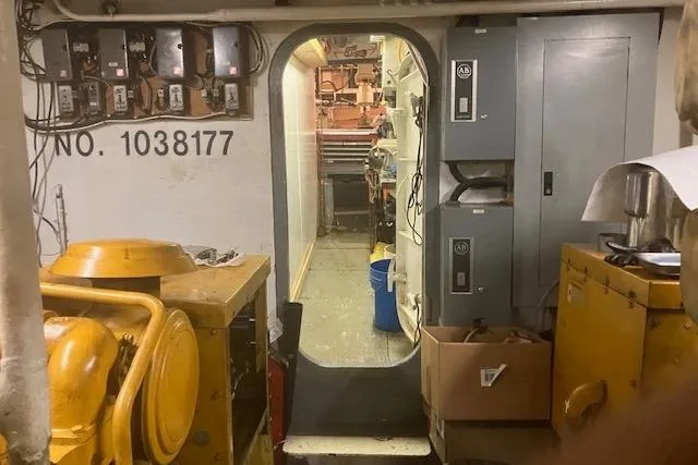 Slide: The Image of Interior of a 1995 custom steel albacore tuna vessel, showcasing equipment and control panels. - 5