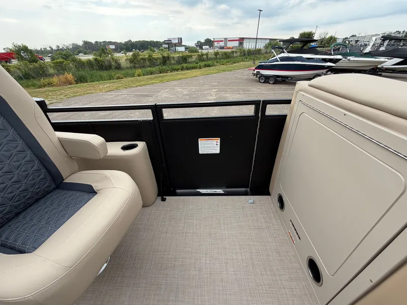 Slide: The Image of The image shows the deck of a 2027 Harris 230SOL with beige seating and a railing. - 36