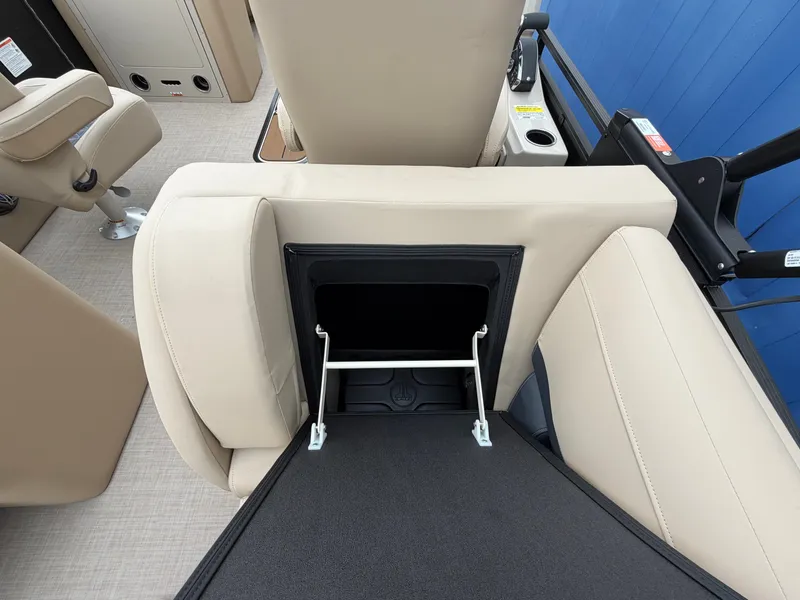 Slide: The Image of A sleek seating area with beige upholstery and a foldable storage compartment. - 17