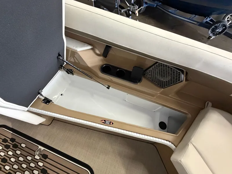 Slide: The Image of Interior of a 2027 Harris 250CRW with seating and cup holders. - 28