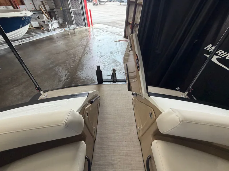 Slide: The Image of The image shows the stern of a 2027 Harris 250CRW boat with beige seating. - 19