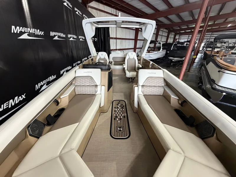 Slide: The Image of Interior view of a Harris 250CRW boat with luxurious seating and modern design in a warehouse. - 15